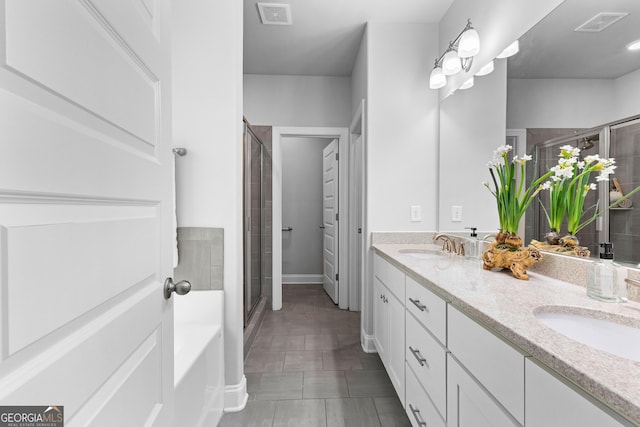 10 Georgian Oaks Ct, Newnan, GA 30265 - full bath featuring a shower stall, double vanity, a bath, baseboards, and tile patterned floors