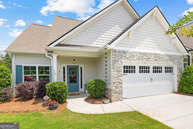 10 Georgian Oaks Ct, Newnan, GA 30265 - craftsman inspired home with a garage, stone siding, concrete driveway, and roof with shingles