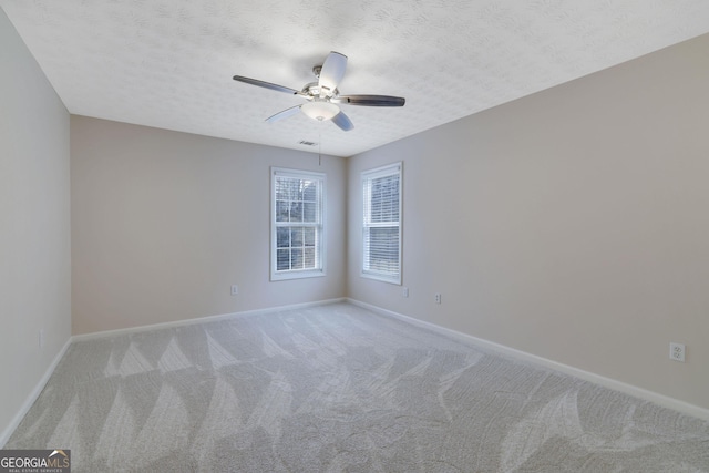 954 Josie Ct, Lawrenceville, GA 30045 - empty room featuring light carpet, a ceiling fan, and a textured ceiling