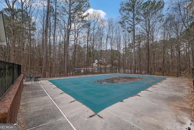 954 Josie Ct, Lawrenceville, GA 30045 - view of swimming pool featuring a patio and a view of trees