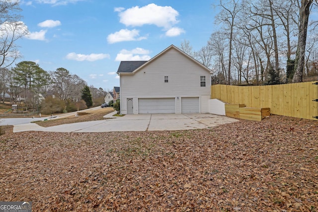 954 Josie Ct, Lawrenceville, GA 30045 - view of side of property featuring a garage and concrete driveway