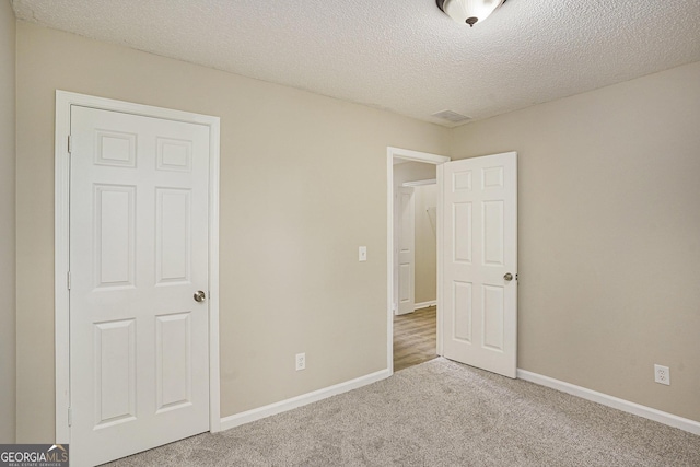 50 Fieldview Ln, Covington, GA 30016 - unfurnished bedroom with carpet and a textured ceiling