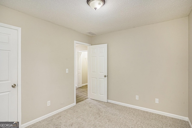 50 Fieldview Ln, Covington, GA 30016 - unfurnished bedroom with light colored carpet and a textured ceiling