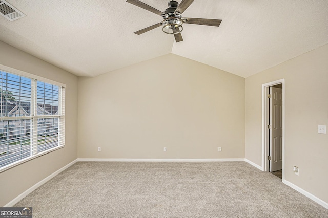 50 Fieldview Ln, Covington, GA 30016 - carpeted spare room with ceiling fan, plenty of natural light, a textured ceiling, and vaulted ceiling
