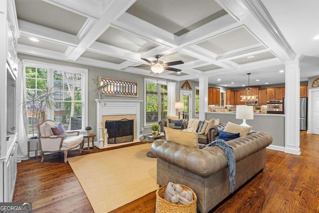 4840 Spring Park Cir, Suwanee, GA 30024 - living room with ornate columns, dark wood finished floors, coffered ceiling, plenty of natural light, and a ceiling fan