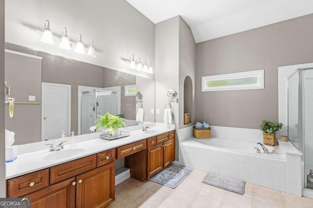 4840 Spring Park Cir, Suwanee, GA 30024 - bathroom featuring a stall shower, double vanity, a bath, and plenty of natural light