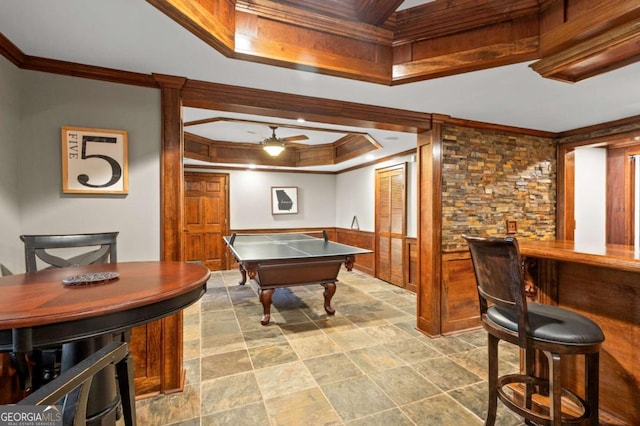 4840 Spring Park Cir, Suwanee, GA 30024 - recreation room featuring a raised ceiling, ornamental molding, ceiling fan, a bar, and stone finish flooring