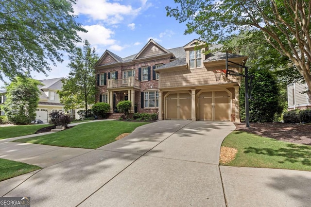 4840 Spring Park Cir, Suwanee, GA 30024 - view of front of property featuring a balcony, concrete driveway, a front lawn, and brick siding