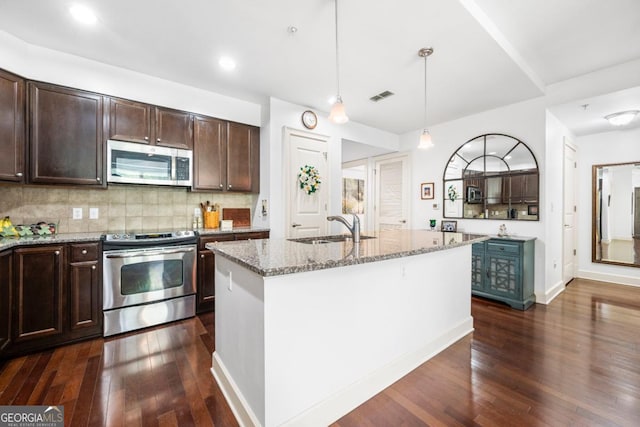 200 River Vista Dr Unit 120, Atlanta, GA 30339 - kitchen with appliances with stainless steel finishes, a sink, dark wood-type flooring, light stone countertops, and dark brown cabinets