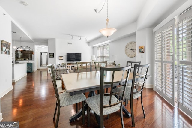 200 River Vista Dr Unit 120, Atlanta, GA 30339 - dining room with dark wood-type flooring, track lighting, and baseboards