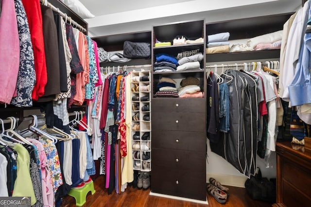 200 River Vista Dr Unit 120, Atlanta, GA 30339 - walk in closet featuring wood finished floors