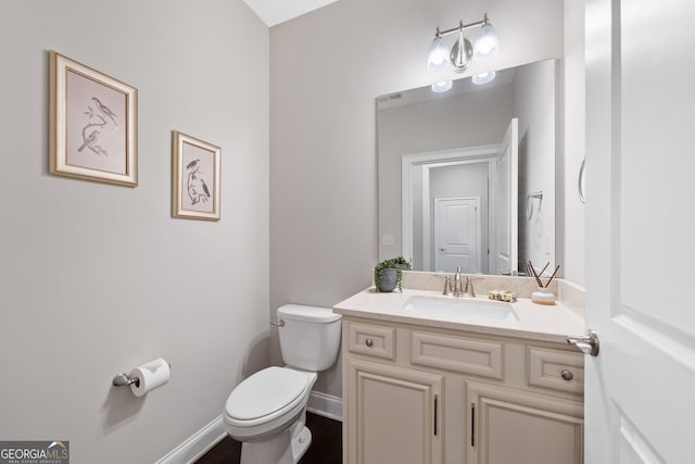 2499 Barrett Preserve Ct SW, Marietta, GA 30064 - bathroom featuring toilet, vanity, and baseboards