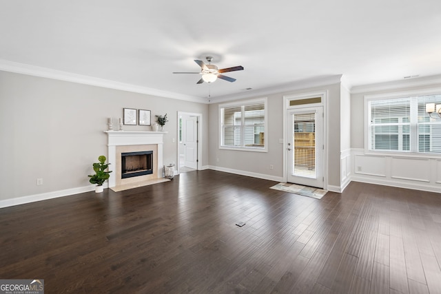2499 Barrett Preserve Ct SW, Marietta, GA 30064 - unfurnished living room featuring ceiling fan, ornamental molding, healthy amount of natural light, a fireplace, and dark wood finished floors