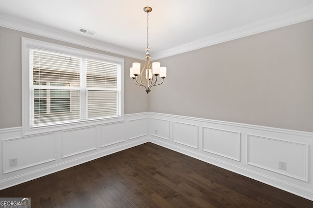 2499 Barrett Preserve Ct SW, Marietta, GA 30064 - unfurnished dining area with a chandelier, a wainscoted wall, crown molding, and dark wood-style flooring