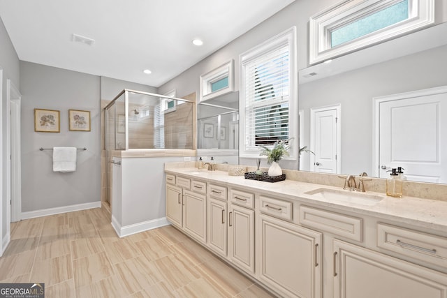 2499 Barrett Preserve Ct SW, Marietta, GA 30064 - bathroom featuring double vanity, a shower stall, baseboards, and recessed lighting