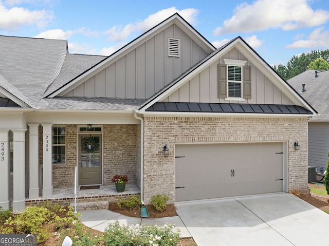 2499 Barrett Preserve Ct SW, Marietta, GA 30064 - craftsman-style house with brick siding, board and batten siding, a shingled roof, driveway, and a garage