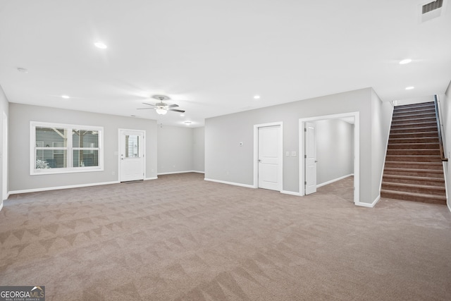 2499 Barrett Preserve Ct SW, Marietta, GA 30064 - unfurnished living room featuring a ceiling fan, carpet flooring, stairs, baseboards, and recessed lighting