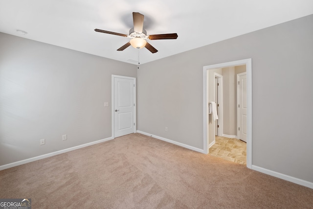 2499 Barrett Preserve Ct SW, Marietta, GA 30064 - unfurnished bedroom with light colored carpet, baseboards, and ceiling fan