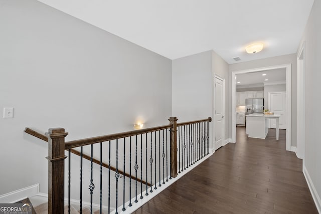 2499 Barrett Preserve Ct SW, Marietta, GA 30064 - hall featuring dark wood-style flooring, an upstairs landing, and baseboards