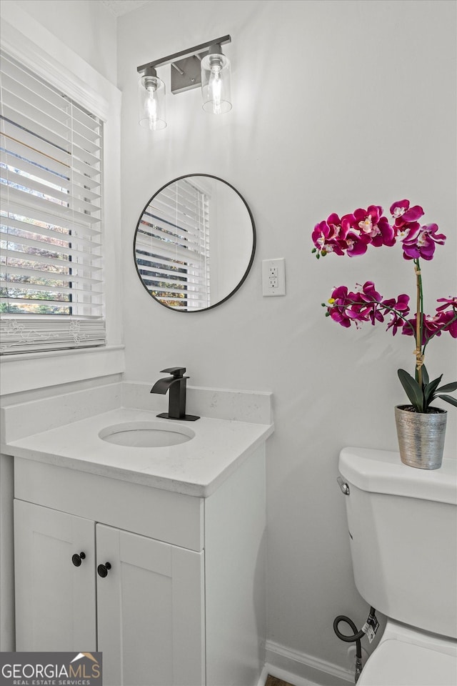 2378 Green Forrest Dr, Decatur, GA 30032 - bathroom with vanity, toilet, and baseboards