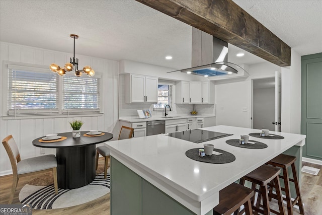 2378 Green Forrest Dr, Decatur, GA 30032 - kitchen with dishwasher, a textured ceiling, light wood-style floors, a sink, and black electric stovetop