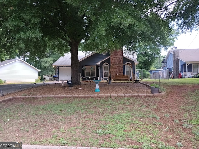 435 Rosehill Dr, Mcdonough, GA 30253 - view of front facade with a garage and asphalt driveway