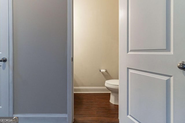 395 Dublin Way, Dallas, GA 30132 - bathroom with wood finished floors, baseboards, and toilet