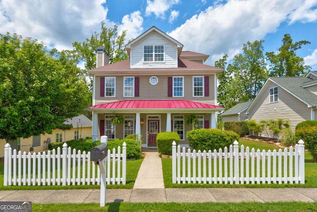 2707 Mariner Way, Villa Rica, GA 30180 - view of front of house featuring a porch, a chimney, a standing seam roof, and metal roof