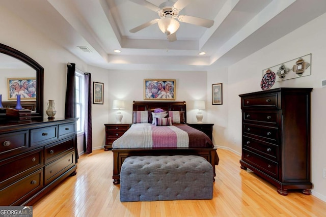2707 Mariner Way, Villa Rica, GA 30180 - bedroom with light wood-style flooring, a tray ceiling, baseboards, a ceiling fan, and recessed lighting