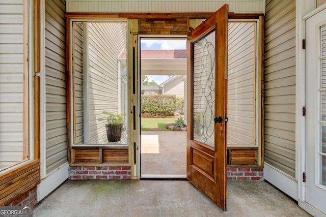 2707 Mariner Way, Villa Rica, GA 30180 - doorway to outside featuring carpet flooring and wooden walls