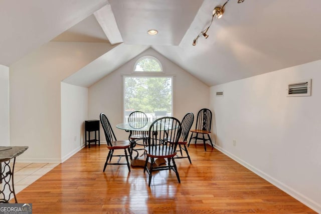 2707 Mariner Way, Villa Rica, GA 30180 - dining space featuring lofted ceiling, light wood finished floors, and baseboards