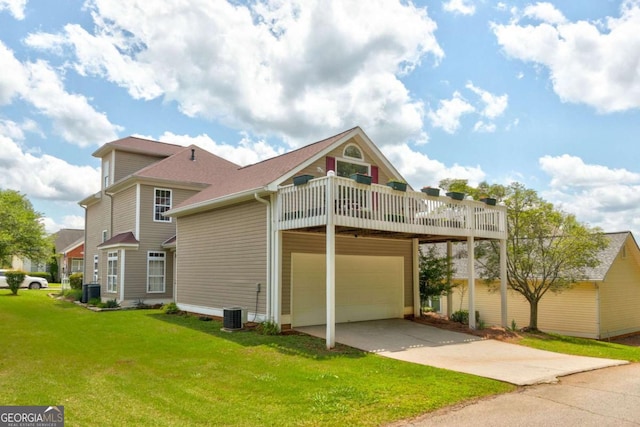 2707 Mariner Way, Villa Rica, GA 30180 - rear view of property with a lawn, concrete driveway, an attached garage, a deck, and a shingled roof