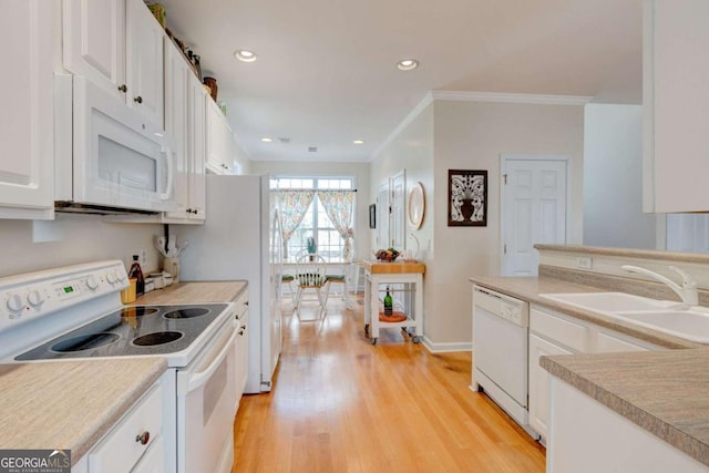 2707 Mariner Way, Villa Rica, GA 30180 - kitchen with white appliances, a sink, crown molding, white cabinetry, and recessed lighting