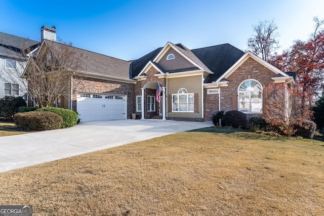 2041 Democracy Dr, Buford, GA 30519 - view of front of house featuring a front lawn, an attached garage, concrete driveway, stone siding, and a chimney