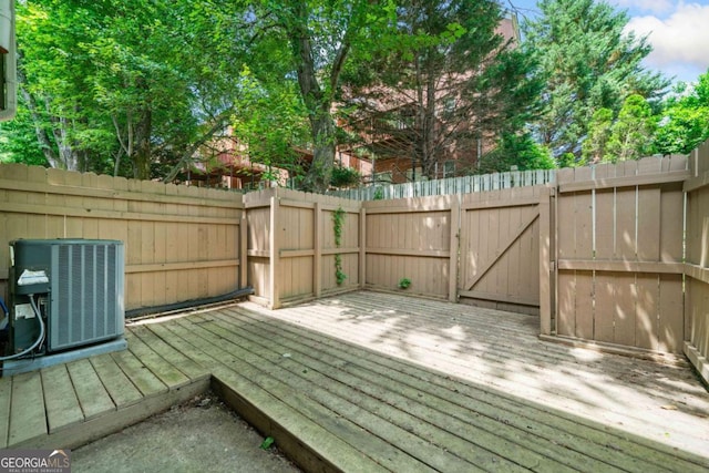3200 Seven Pines Ct Unit 103, Atlanta, GA 30339 - wooden terrace featuring central AC unit and a fenced backyard