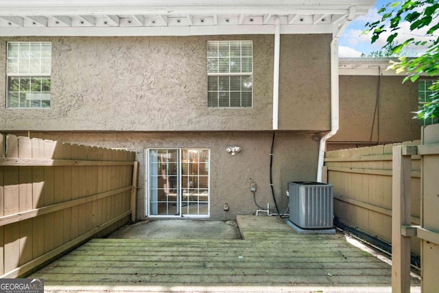 3200 Seven Pines Ct Unit 103, Atlanta, GA 30339 - back of house with central air condition unit, stucco siding, and fence