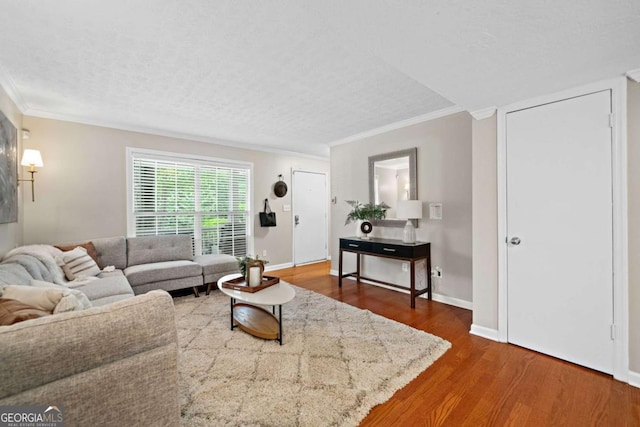 3200 Seven Pines Ct Unit 103, Atlanta, GA 30339 - living room with ornamental molding, wood finished floors, baseboards, and a textured ceiling