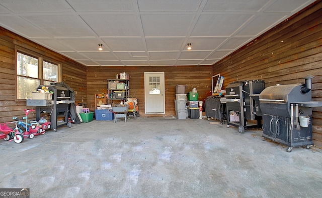 garage with wooden walls and recessed lighting