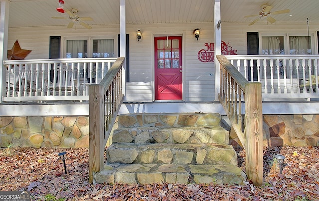 doorway to property with ceiling fan and a porch