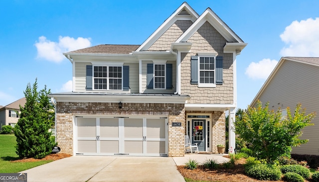 6658 Rivergreen Rd, Flowery Branch, GA 30542 - craftsman-style house featuring an attached garage, concrete driveway, and brick siding