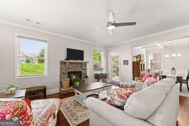 6658 Rivergreen Rd, Flowery Branch, GA 30542 - living area featuring wood finished floors, a chandelier, a ceiling fan, a fireplace, and crown molding