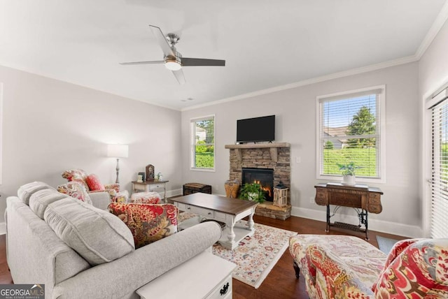 6658 Rivergreen Rd, Flowery Branch, GA 30542 - living area with ceiling fan, crown molding, a stone fireplace, and wood finished floors