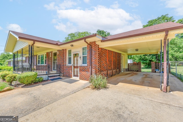 170 Northcrest Dr, Athens, GA 30601 - view of front of home with driveway, brick siding, a porch, and fence