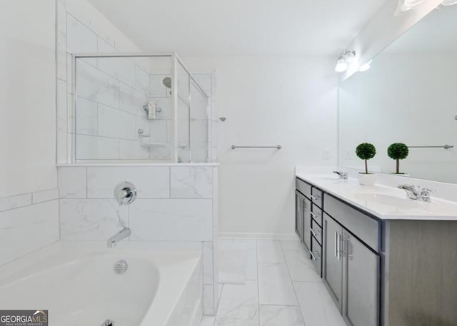 full bathroom featuring marble finish flooring, a garden tub, a tile shower, and double vanity