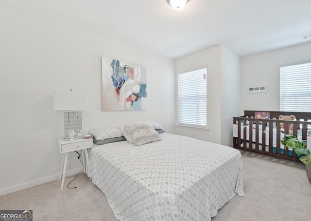 carpeted bedroom with baseboards