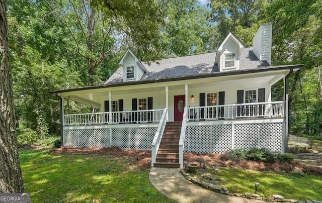 farmhouse-style home with stairs, a chimney, and covered porch