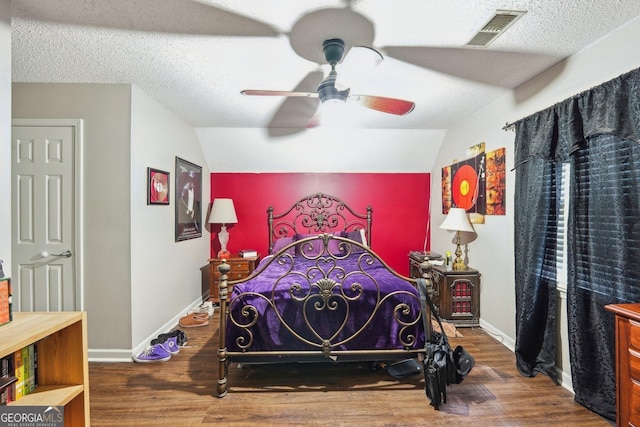 230 Vienna Way, Douglasville, GA 30134 - bedroom with vaulted ceiling, wood finished floors, baseboards, ceiling fan, and a textured ceiling