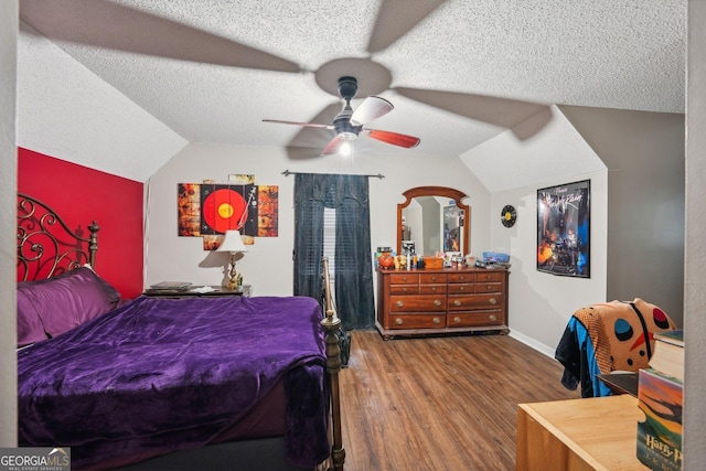 230 Vienna Way, Douglasville, GA 30134 - bedroom with lofted ceiling, wood finished floors, a textured ceiling, baseboards, and ceiling fan