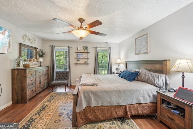 230 Vienna Way, Douglasville, GA 30134 - bedroom featuring a textured ceiling, wood finished floors, baseboards, and a ceiling fan