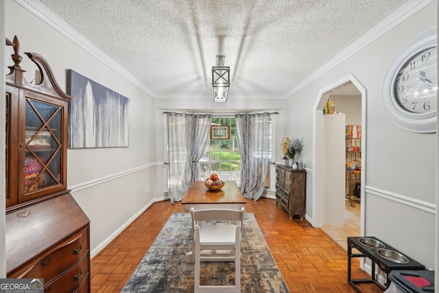 230 Vienna Way, Douglasville, GA 30134 - dining space featuring a textured ceiling, crown molding, arched walkways, and baseboards